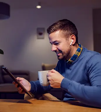 Man using his phone at home