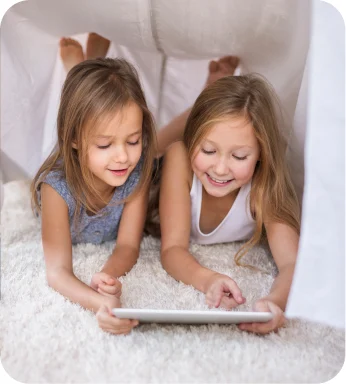 Two children watching a tablet together