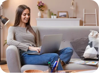 Woman relaxing on the sofa with a laptop